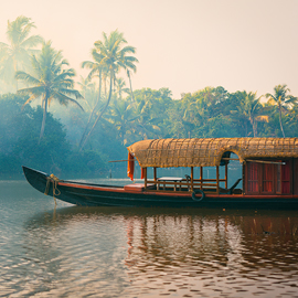 Houseboat cruising through the Kumarakom backwaters